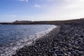 Panoramic view on black stone pebble beach Playa Colmenares near Amarilla, Golf del Sur, Tenerife, Canary Islands, Spain,