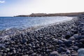 Panoramic view on black stone pebble beach Playa Colmenares near Amarilla, Golf del Sur, Tenerife, Canary Islands, Spain,