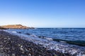 Panoramic view on black stone pebble beach Playa Colmenares near Amarilla, Golf del Sur, Tenerife, Canary Islands, Spain,