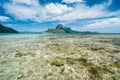 Panoramic view of blue lagoon and banca boats in front of epic Cadlao Island. Palawan, Philippines. Holiday vacation concept Royalty Free Stock Photo