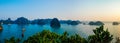 Panoramic view of boats floating in the tranquil waters of Halong Bay Vietnam at sunset Royalty Free Stock Photo