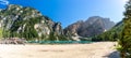 Panoramic view of the Braies Lake with tourists at the Prags Dolomites in Tyrol, Italy Royalty Free Stock Photo