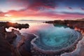 panoramic view of a breathtaking natural pool at sunrise/sunset