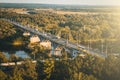 Panoramic view of bridge over river Klyazma in Vladimir city with railroad and green trees in summer day, toned