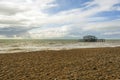 Panoramic view of Brighton`s beach. In the background they are the remains of Brighton West Pier in sea Royalty Free Stock Photo