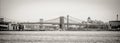 Panoramic View of Brooklyn Bridge Crossing East River. Black and White Perspective. Manhattan, New York City Royalty Free Stock Photo