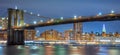 Panoramic view of Brooklyn Bridge at night with lights, New York Royalty Free Stock Photo