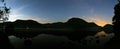 A Panoramic view of Brotherswater with a mist on the water