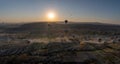 Panoramic view of bunch of colorful hot air balloon flying against sunrise in Cappadocia, Turkey in love valley located in Goreme