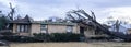 Panoramic view bungalow house damaged by tornado and tree falls in Dallas, Texas