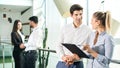 Panoramic view of business people having informal meeting in the office building. Royalty Free Stock Photo