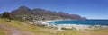 Panoramic view of Camps Bay Beach in Cape Town, South Africa, with green grass, lonaly tree and the Twelve Apostles Royalty Free Stock Photo