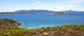 Panoramic view of Caprera Island and Spiaggia di Cala Portese harbor at the Tyrrhenian Sea coastline with Isola Porco island, La