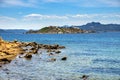 Panoramic view of Caprera Island and Spiaggia di Cala Portese harbor at the Tyrrhenian Sea coastline with Isola Porco island, La