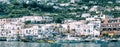 Panoramic view of Capri Island restaurants and shops along the port promenade, Italy Royalty Free Stock Photo