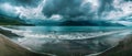 A panoramic view captures the tempestuous beauty of a stormy sea against a rugged coastline, where the drama of nature Royalty Free Stock Photo