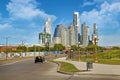 Panoramic view of car driving towards the skyline of Buenos Aires, against a blue summer sky with few white clouds.