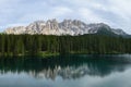 Panoramic view of Carezza Lake with reflecting in the water mount Latemar, Italy