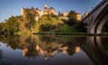 Panoramic view of castles and bridge across the river at sunset Royalty Free Stock Photo