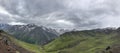 Panoramic view of Caucacian mountains and glaciers, cloudy sky, Royalty Free Stock Photo