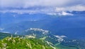 Panoramic view of Caucasian mountains under blue cloudy sky Royalty Free Stock Photo