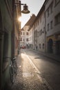 Panoramic view of a charming street scene in an old town in Europe in beautiful evening light at sunset