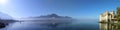 Panoramic view of Chillon castle next to Montreux with fog over the lake in sunny autumn weather Royalty Free Stock Photo