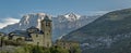 Panoramic view of the church of san sebastian de torla and snow-capped mountains of the valley of ordesa in the background. Huesca