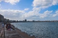 Panoramic view of the city Embankment and the Port with Road, Buildings, Cars and Palm Trees in Alexandria, Egypt