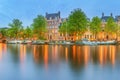 Panoramic view and cityscape of Amsterdam with boats, old buildings and Amstel river, Holland, Netherlands Royalty Free Stock Photo