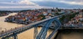 Panoramic sunset view of Porto Portugal cityscape with Dom Luis I Bridge and Douro River Royalty Free Stock Photo