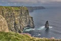 Panoramic view of the Cliffs of Moher, Ireland. Cliffs of Moher during sunset. Coastline in Ireland with huge cliffs Royalty Free Stock Photo