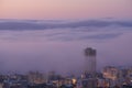 Panoramic view of clouds covering buildings at sunset in the popular city of Cape Town, South Africa with copy space. A Royalty Free Stock Photo