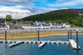 Panoramic view of the coastal town of Ullapool with its typical white houses and docks to dock boats, Scotland. Royalty Free Stock Photo