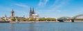 Panoramic view of the Cologne Cathedral with Hohenzollern Bridge and Rhine River in Germany, the church Great St. Martin at the Royalty Free Stock Photo