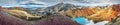 Panoramic view of colorful Icelandic rainbow volcanic Landmannalaugar mountains, famous Laugavegur hiking trail, group of hikers,