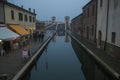 Panoramic view of Comacchio at winter time with fog and Christmas light, Emilia-Romagna Royalty Free Stock Photo