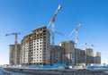 Panoramic view of a construction site with high cranes of apartment houses in microdistricts Royalty Free Stock Photo