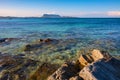 Costa Smeralda coast of Tyrrhenian Sea and Isola Tavolara island seen from San Teodoro resort town in Sardinia, Royalty Free Stock Photo