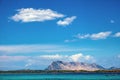 Costa Smeralda coast of Tyrrhenian Sea and Isola Tavolara island seen from San Teodoro resort town in Sardinia, Royalty Free Stock Photo