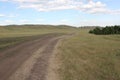Panoramic view. Country road. Forests and fields. Green grass. Blue sky. Summer. Royalty Free Stock Photo