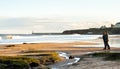 Panoramic View of Couple walking on the British Seaside at Sunset in Tynemouth, United Kingdom 02