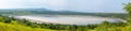 Panoramic view of a crater lake in Queen Elizabeth National Park in Uganda. Royalty Free Stock Photo