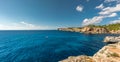 Panoramic view of Crystalline turquoise waters of Cala S`Almunia beach from cap des moro. Royalty Free Stock Photo