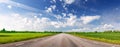 Panoramic view of the curve asphalt road in spring in nature. Royalty Free Stock Photo