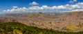 Panoramic view of cuzco with white clouds over blue sky Royalty Free Stock Photo