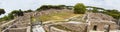 Panoramic view - 180 degree in the excavation ruin at Ostia Antica - from the Decumanus  Maximum to the Neptune thermal baths with Royalty Free Stock Photo