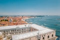 Panoramic view of the Dodge Palace, the Adriatic Sea and red-tiled roofs of houses in Venice, Italy