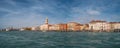 Panoramic view of Doge Palace, Campanile and San Marco square from Grand Canal main water area during evening warm sunset, Venice Royalty Free Stock Photo