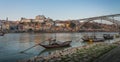 Panoramic view of Douro River with Traditional Rabelo boats, Ribeira Skyline and Dom Luis I Bridge - Porto, Portugal Royalty Free Stock Photo